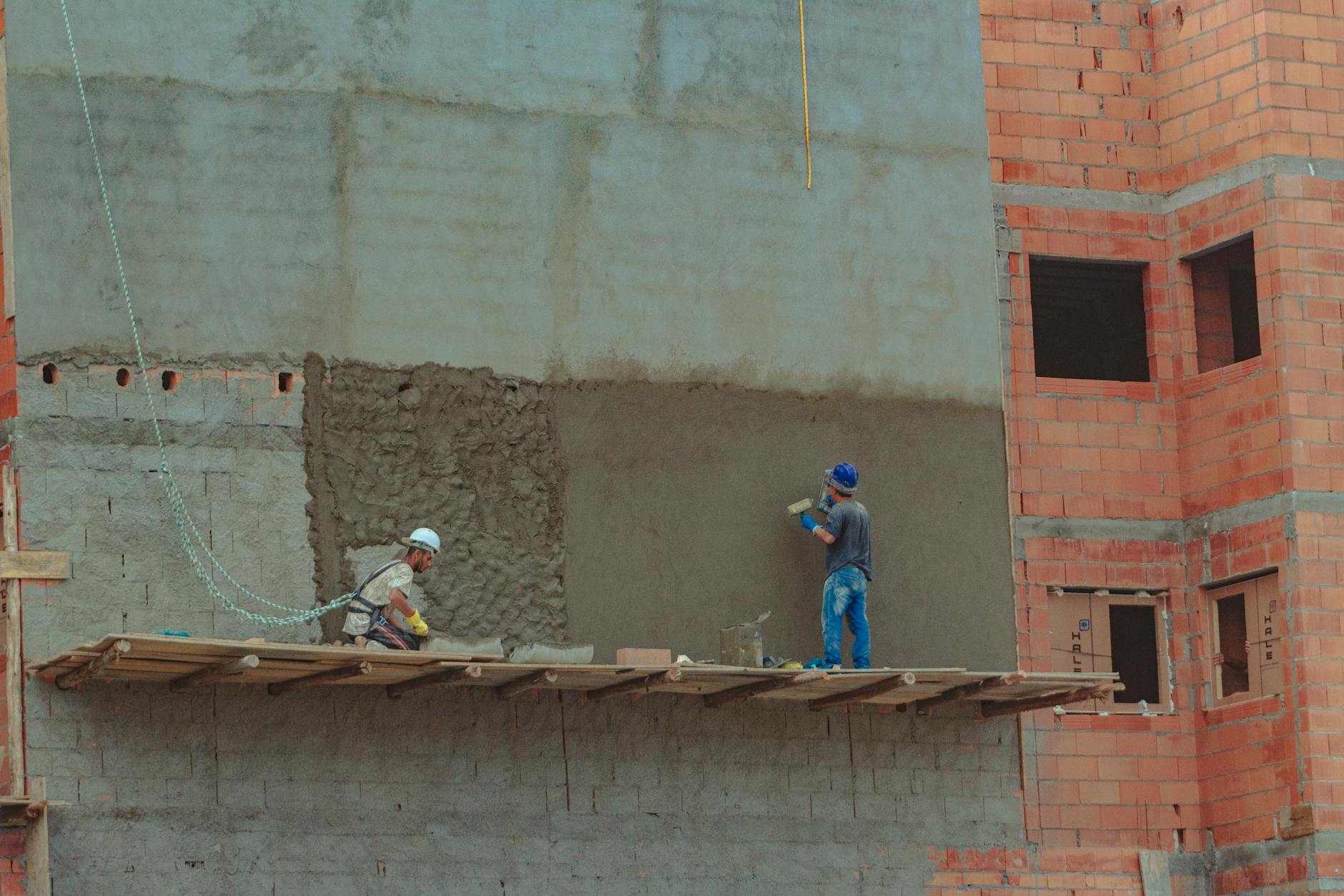 Construction Worker Building Wall