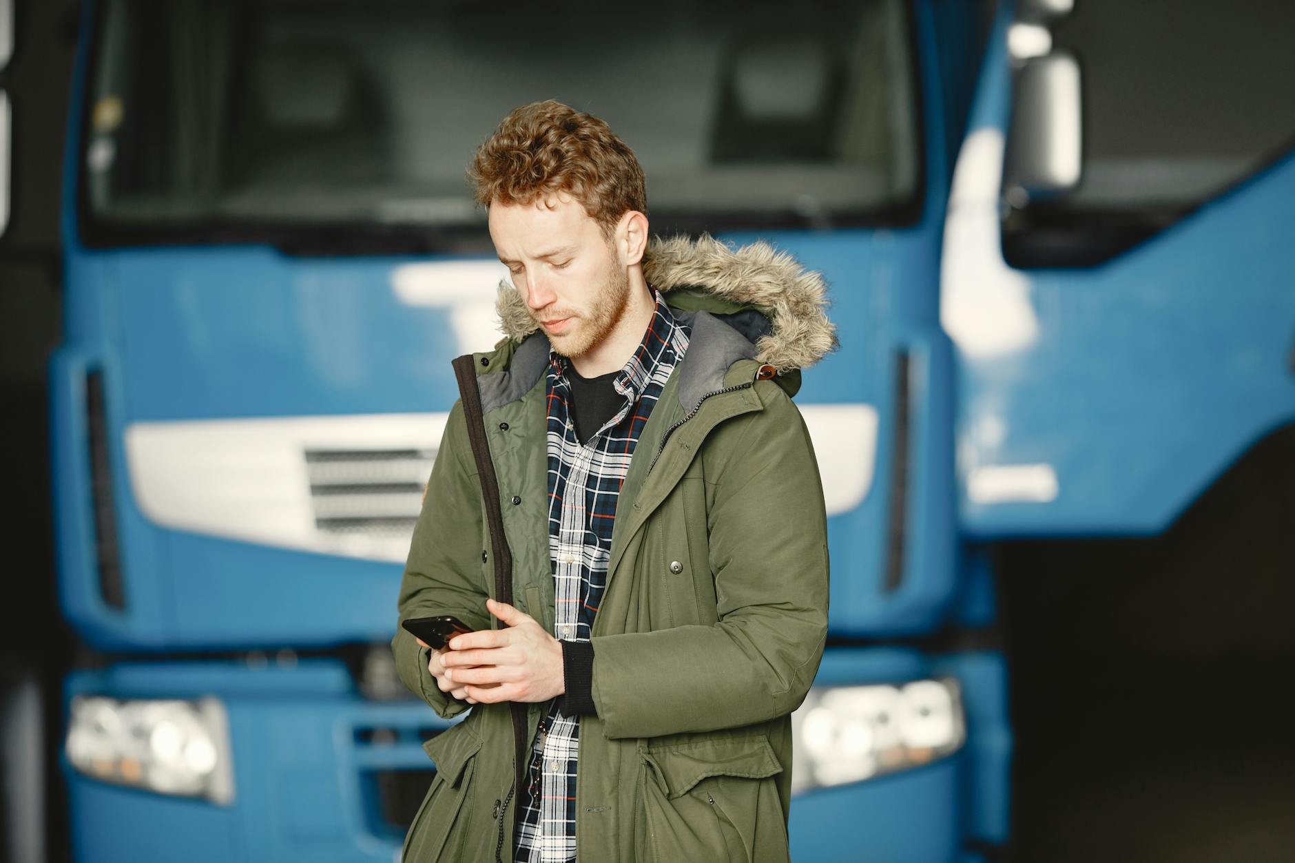 Man Taking Phone Call Outside Porch Garage