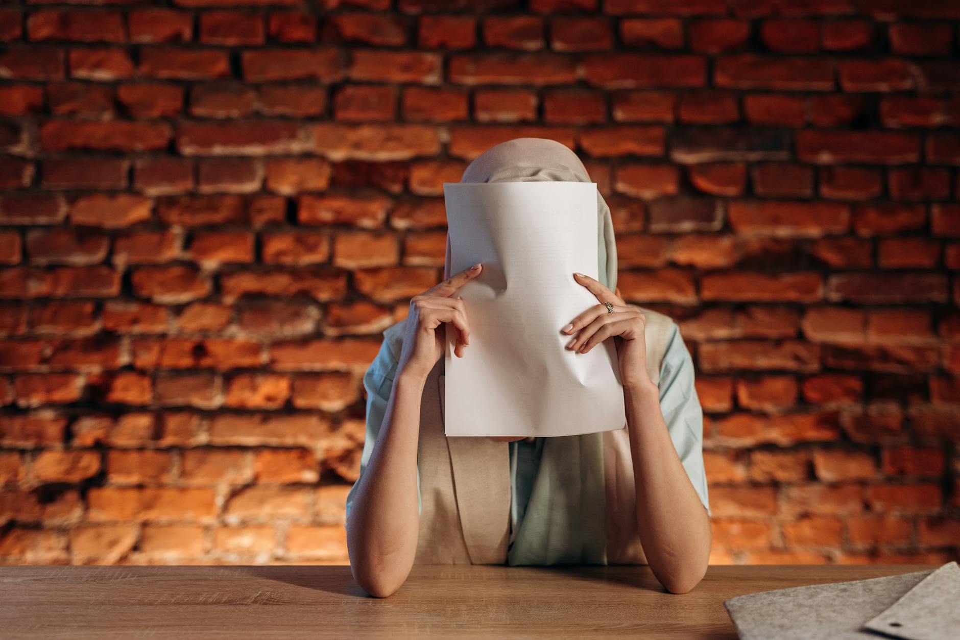 Person Hiding Documents