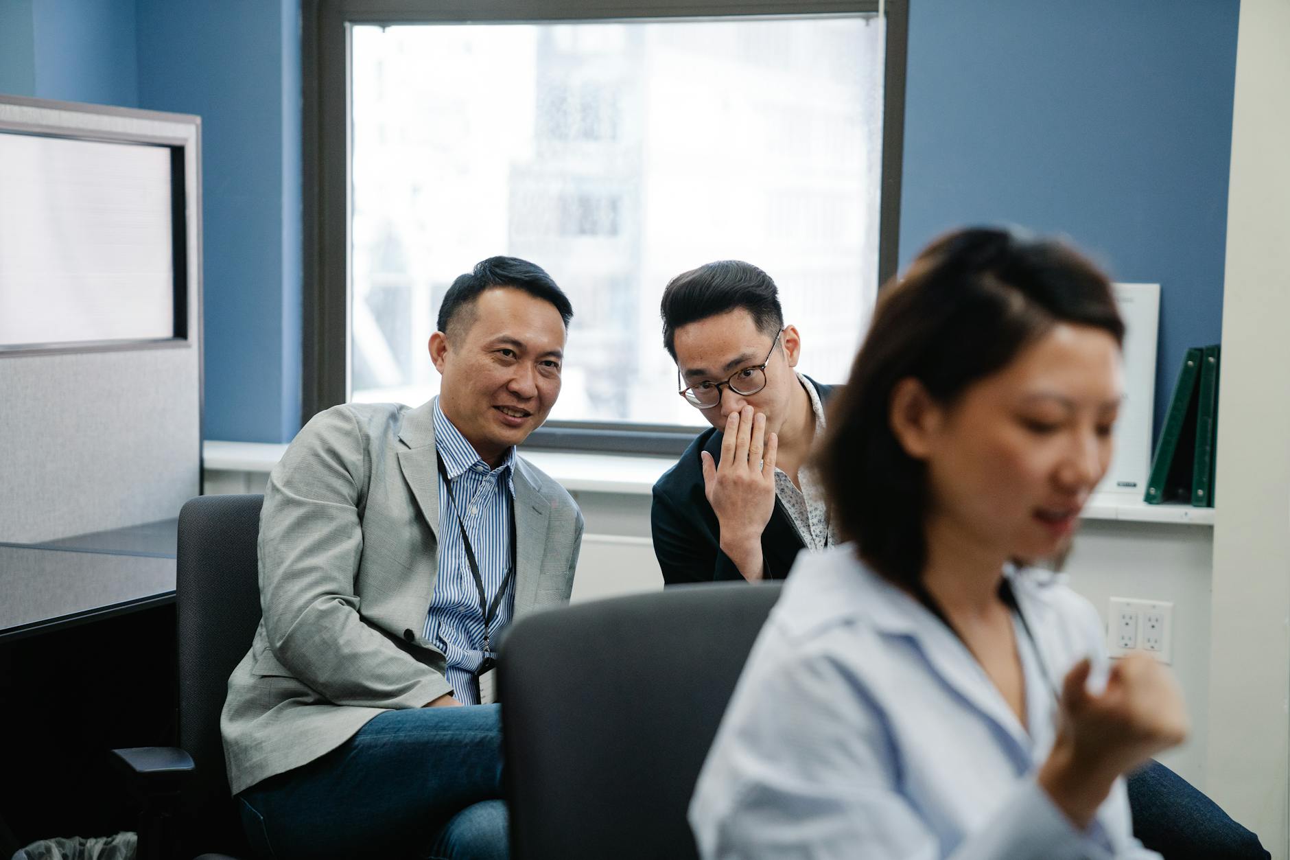 Group Of Coworkers Whispering