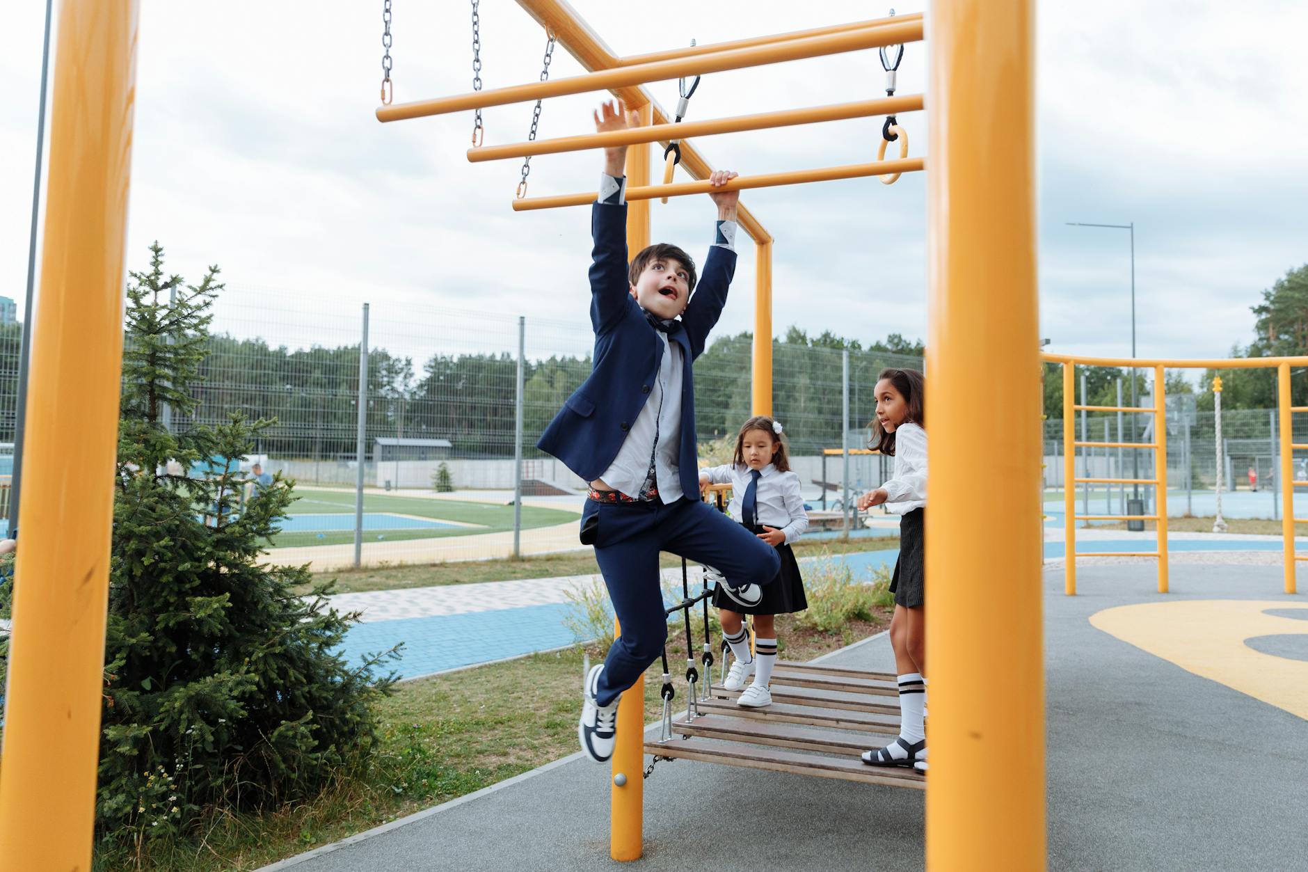 Kids Play On Gym Equipment