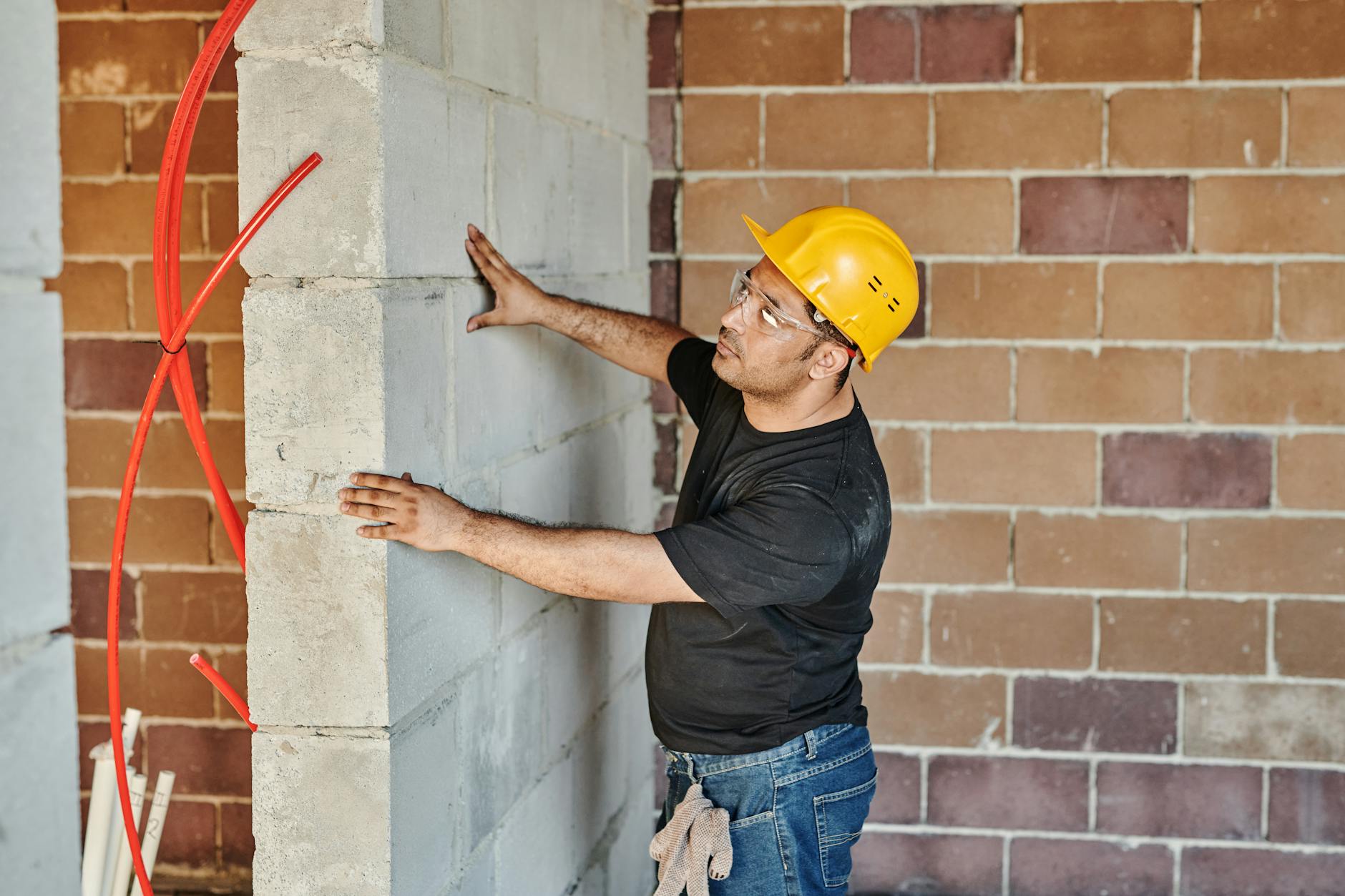 Construction Worker Removing Wall