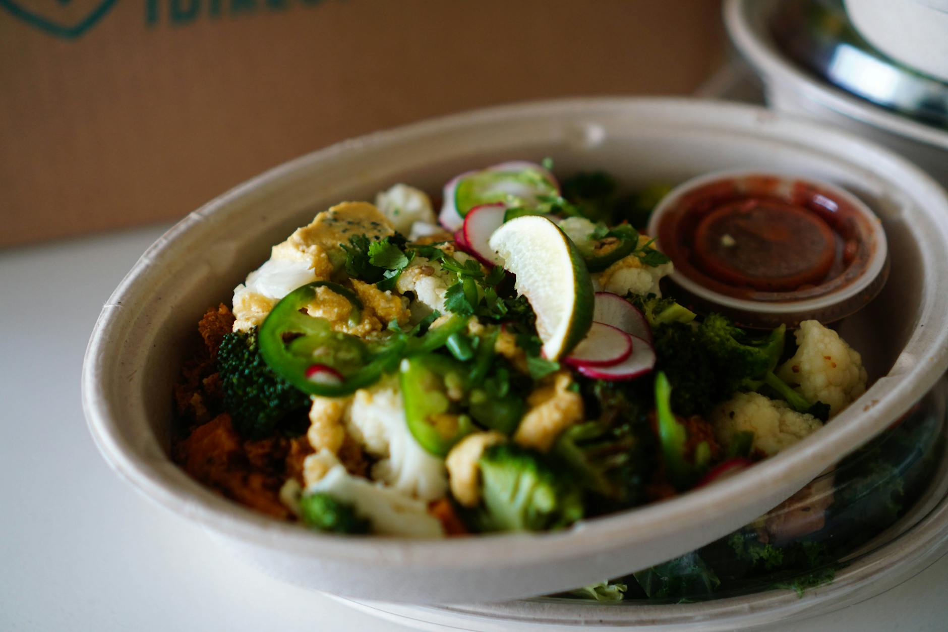 Keto Taco Salad With Avocado, Ground Turkey, Romaine Lettuce, Guacamole, Olives, Radishes, Lime Juice, Sour Cream