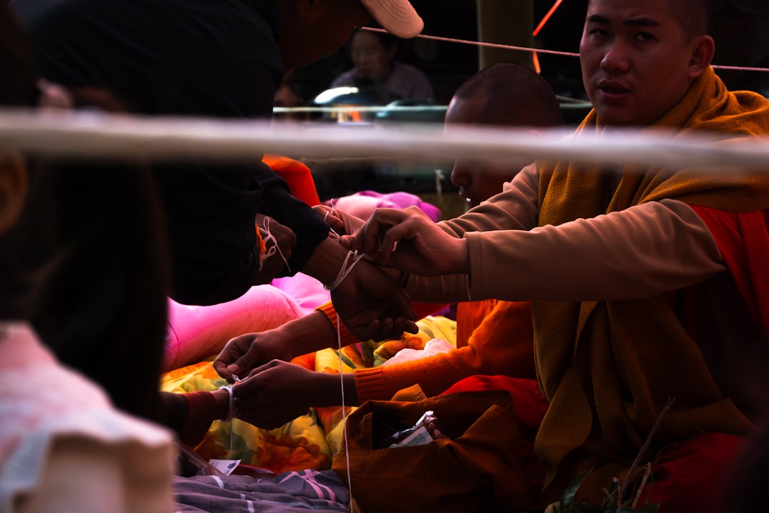 Monk Tying Bracelet