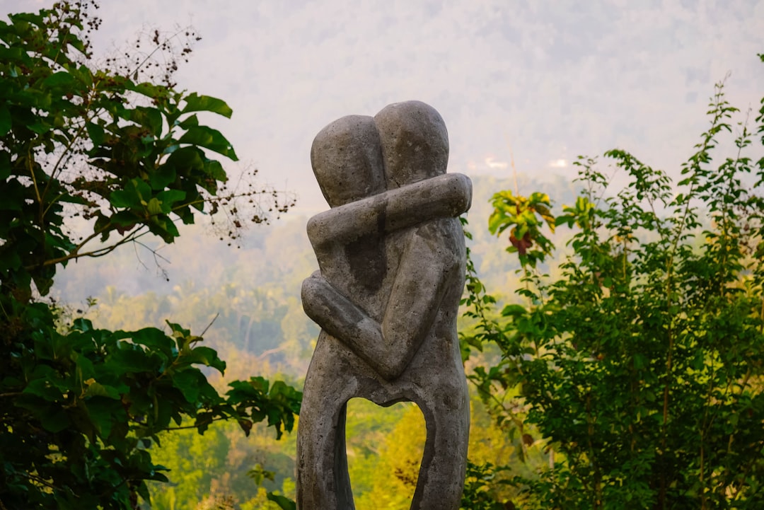 Couple In Distant Embrace