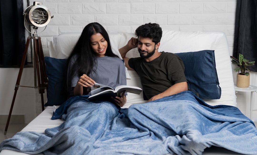 Couples Reading In Bed