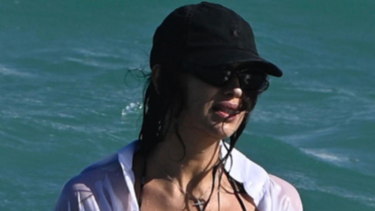 Irina Shayk’s White Blouse And Polka Dot Bikini Is The Timeless Beach Uniform To Copy