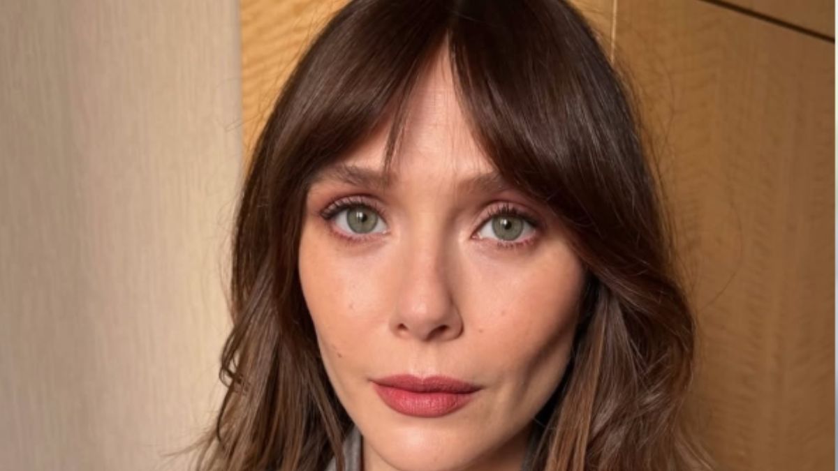 Elizabeth Olsen’s Curve-Hugging Black Dress Is the Ultimate Timeless Power Piece