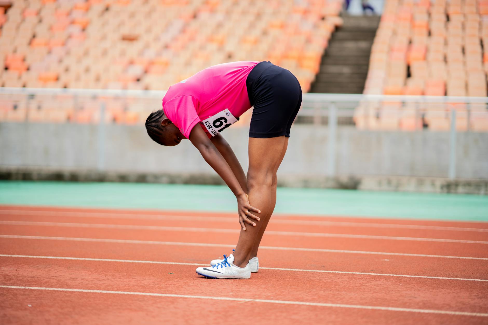 Tired Athlete Stretching