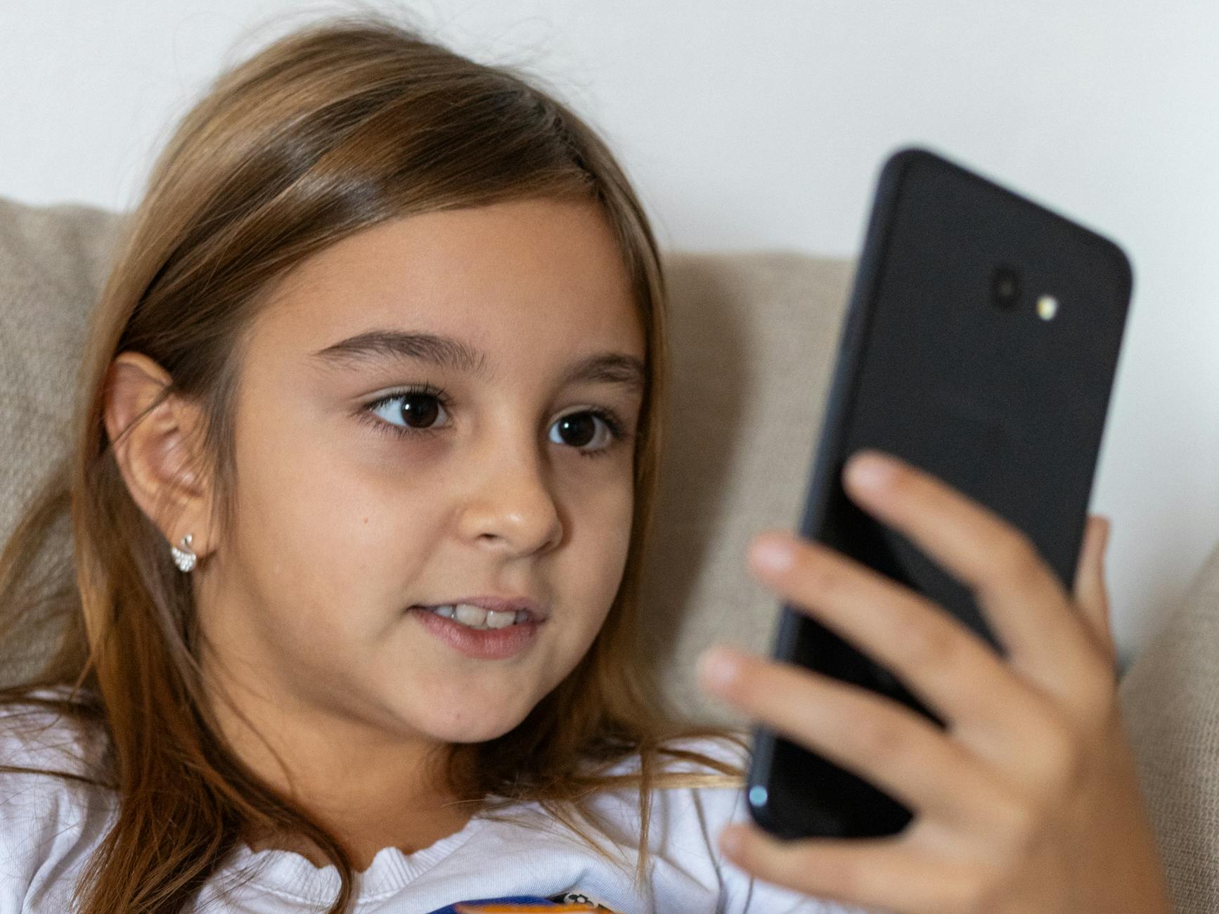 Confident Child With Smartphone