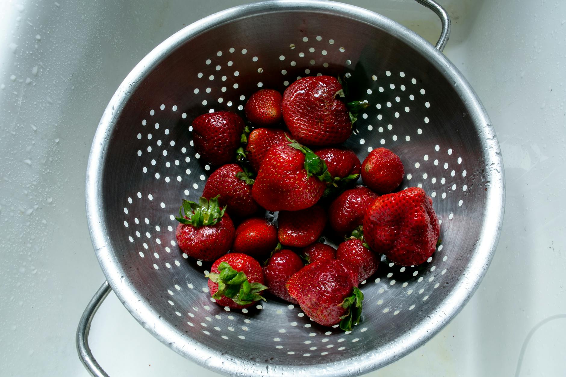 Rinsing Blueberries In Colander