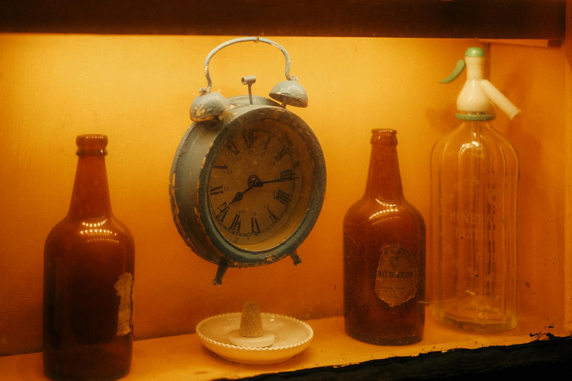 Broken Clock And Empty Bottle