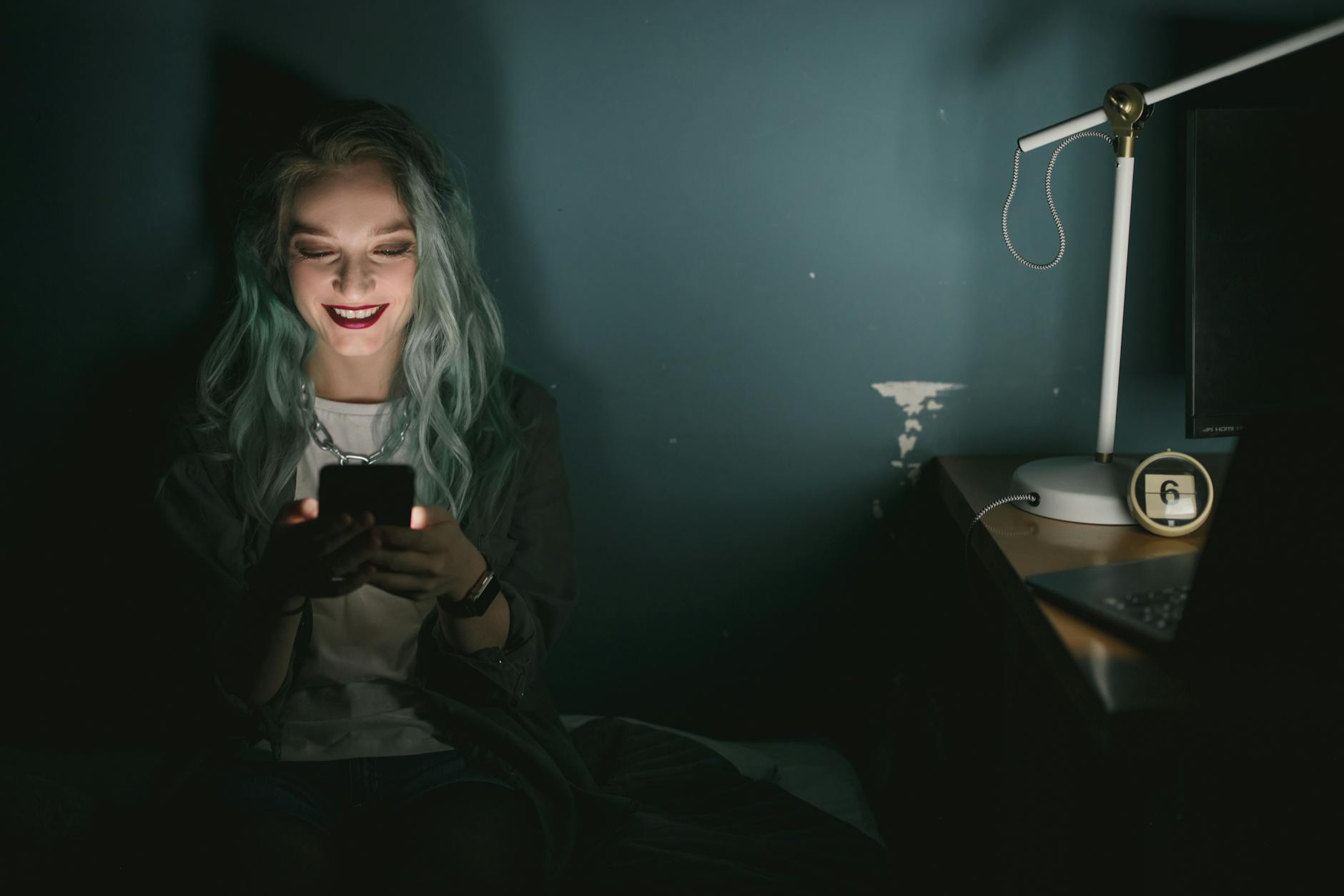 Teenager Using Devices At Night