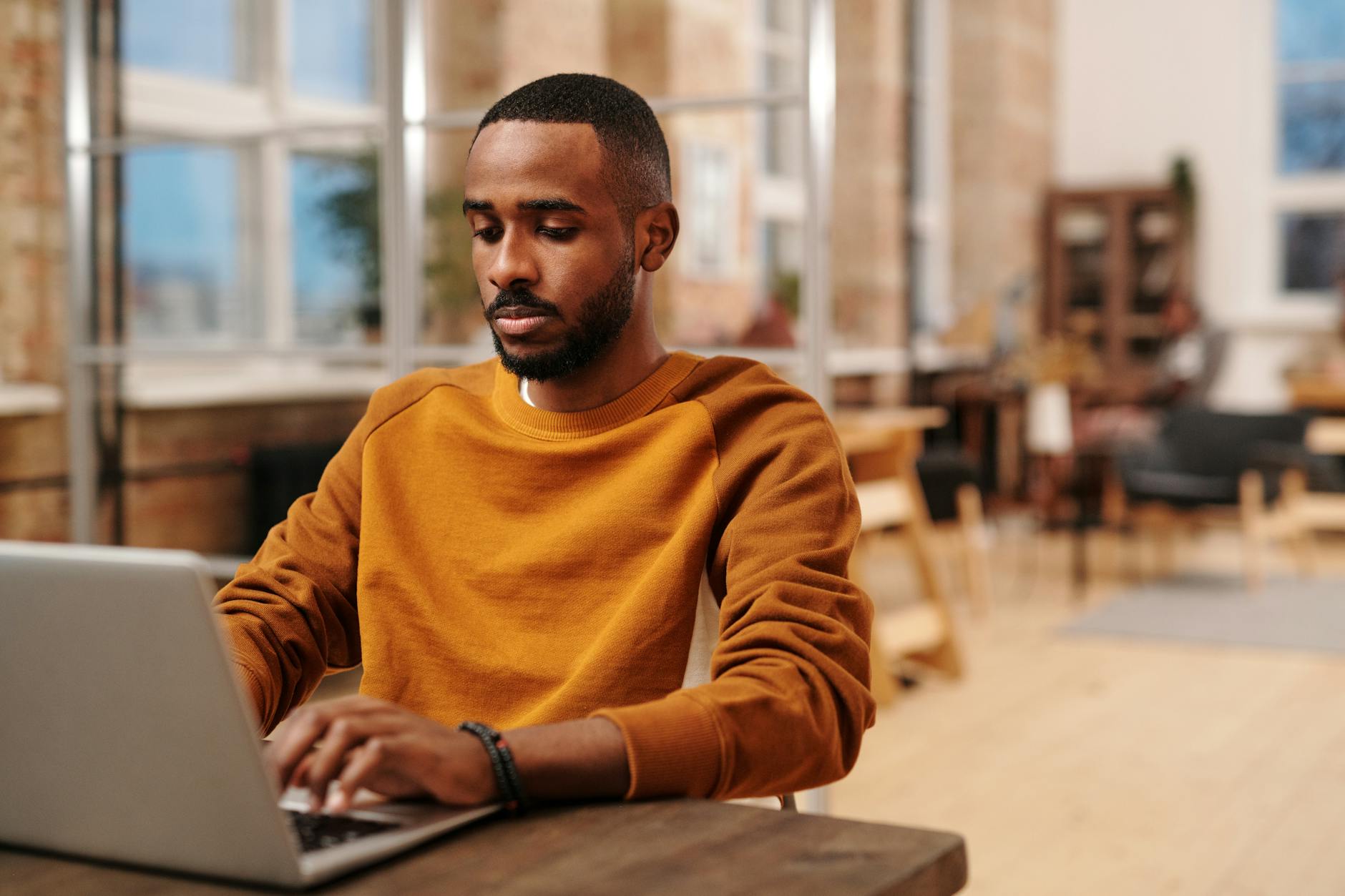 man working on laptop in office