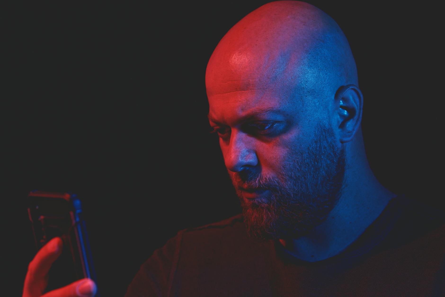 man looking at screen in dark