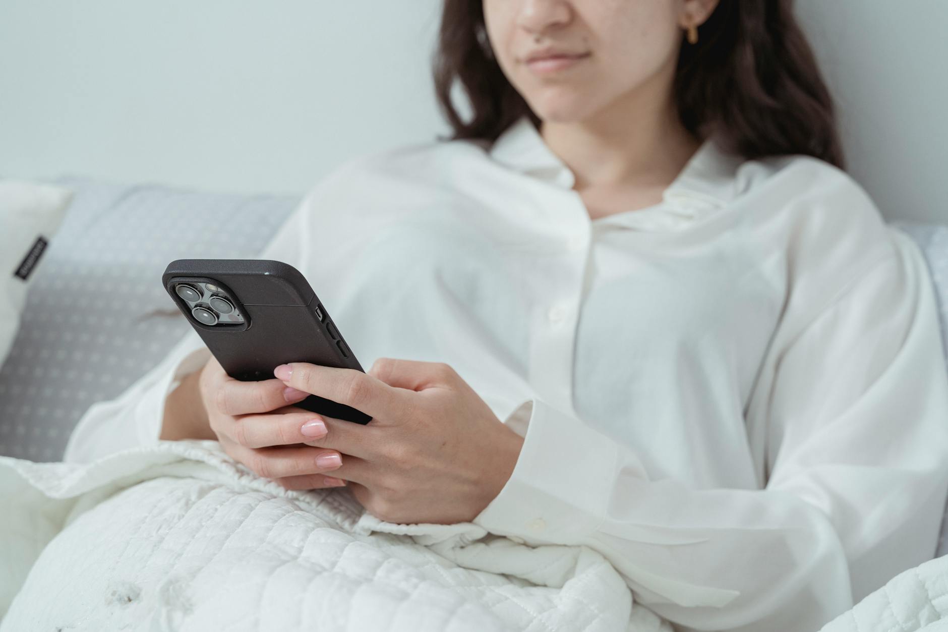 phone checking in bed