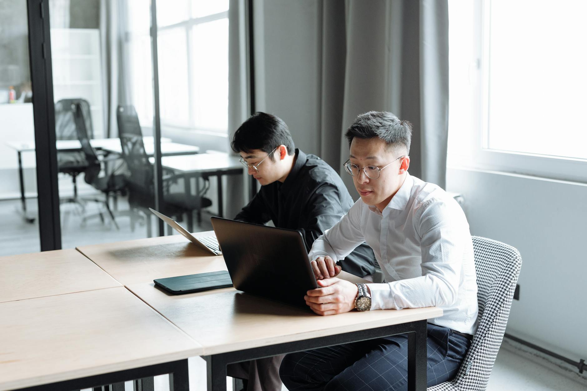 men looking in laptop