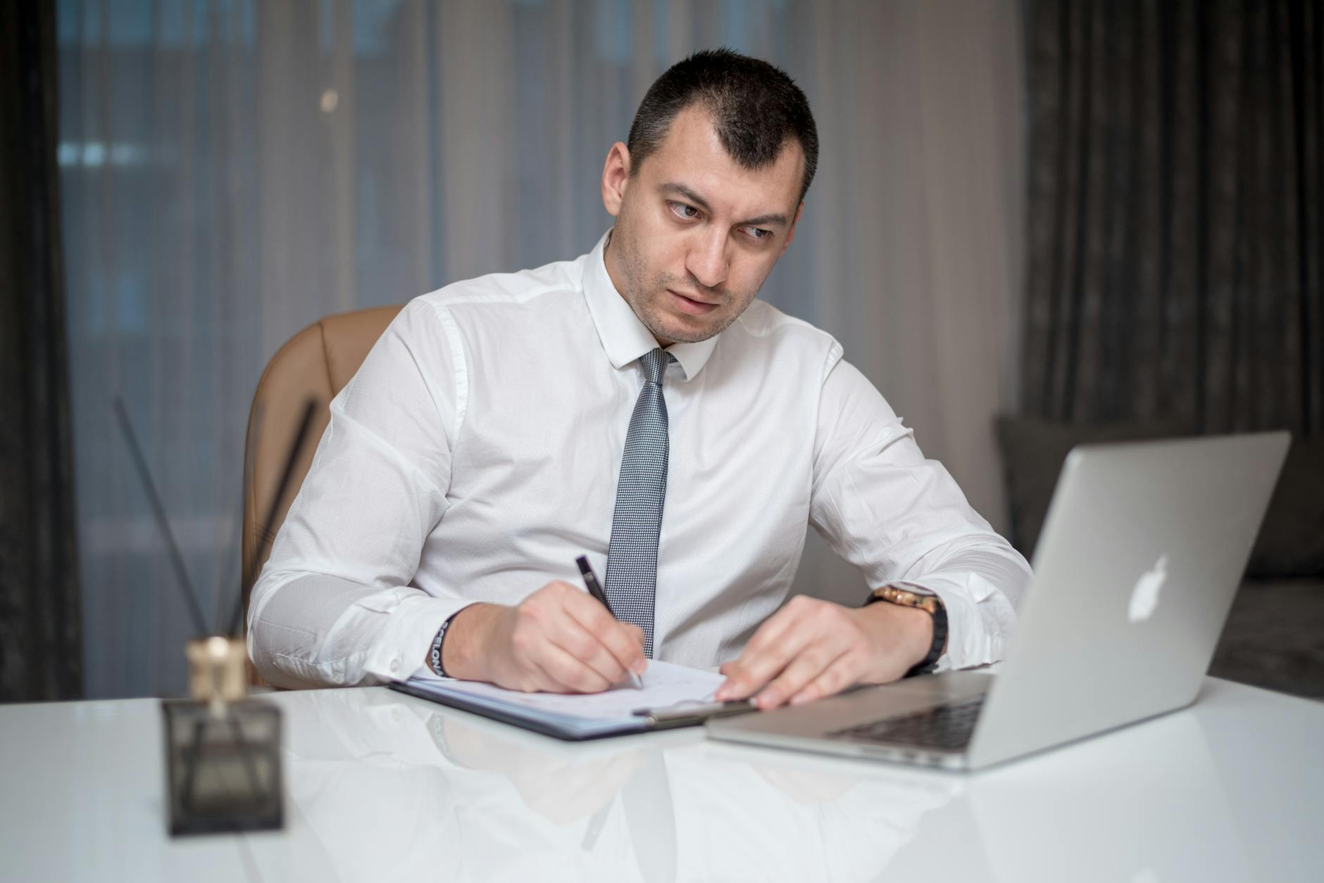 Stressed Professional At Desk